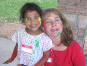 Child and mother with paint-smeared faces
